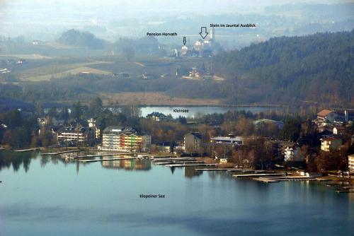 a view of a river with a town and a city at Pension Horvath in Sankt Kanzian