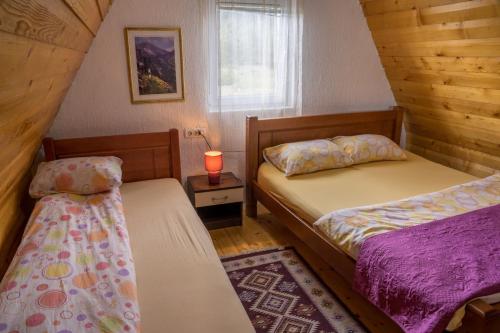 En eller flere senge i et værelse på Village Borje