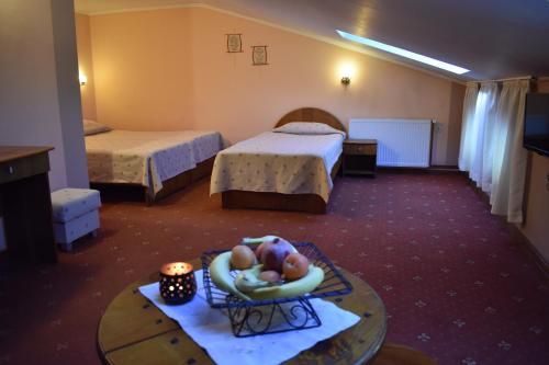 Postel nebo postele na pokoji v ubytování Family Hotel Bashtina Kashta