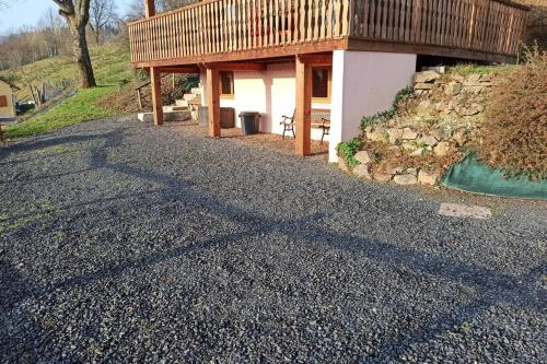 a house with a shadow on the ground at Le Chalet du bonheur , individuel avec belle vue in Laveline