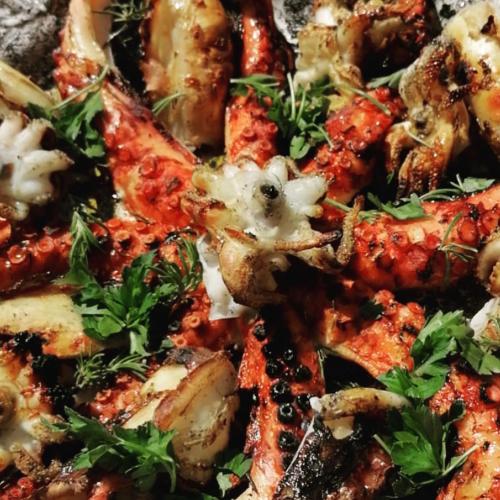 a close up of a pizza with parsley on it at Villa Francesca - Manfredi Homes&Villas in Monte SantʼAngelo