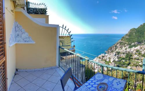 a balcony overlooking a beach with a view of the ocean at Casa TerryB - il Monticello in Positano