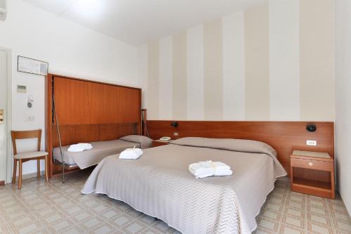 Cama o camas de una habitación en Hotel Brunella