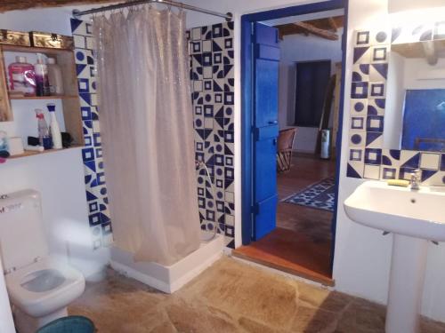 a bathroom with a shower and a toilet and a sink at The traditional hause with the best view in Leonidion