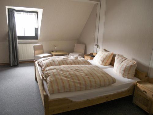 Кровать или кровати в номере Hotel Brauer