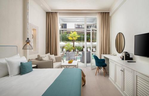a bedroom with a bed and a living room at Siena Premium Retreat in Lozenets