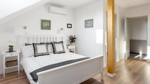 Postel nebo postele na pokoji v ubytování Premium Vendégház