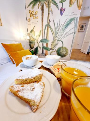 a table with two slices of bread on a plate at Napoli Tree - Lungomare in Naples