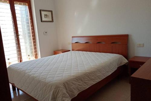 Llit o llits en una habitació de Appartamento tra mare e centro paese