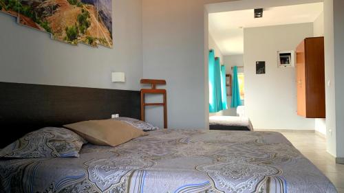 Een bed of bedden in een kamer bij B&B Coração Ponta do Sol