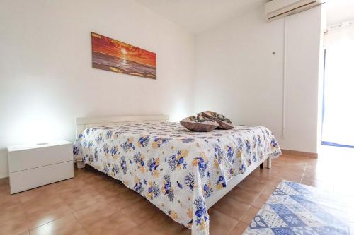 A bed or beds in a room at ERICE BEACH MARE DELUX