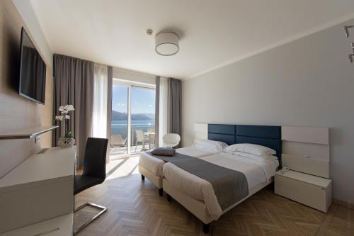 เตียงในห้องที่ B&B Hotels Park Hotel Suisse Santa Margherita Ligure