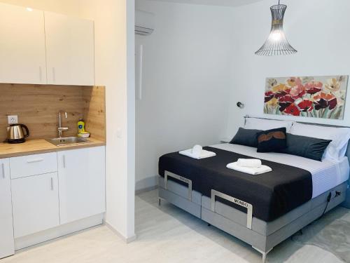 Ένα ή περισσότερα κρεβάτια σε δωμάτιο στο Villa Franko Baška Voda