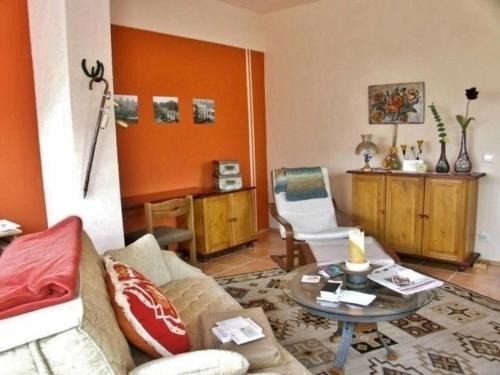 a living room with a couch and a table at Pfaelzer Stuben in Landstuhl