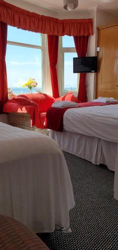 Un ou plusieurs lits dans un hébergement de l'établissement Ash Hotel B&B