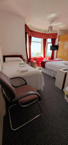 Un ou plusieurs lits dans un hébergement de l'établissement Ash Hotel B&B