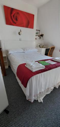 Un ou plusieurs lits dans un hébergement de l'établissement Ash Hotel B&B