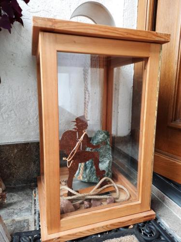 a wooden frame with a picture of a soldier in it at Haus Angerbichl in Ramsau