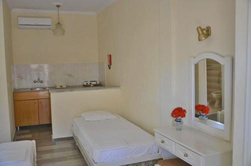 Postel nebo postele na pokoji v ubytování Seafront Apartments
