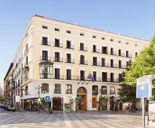 a large building with a clock on the front of it at Francisco I Boutique in Madrid