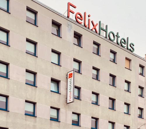a hotel sign on the side of a building at Felix Hotel Darmstadt in Darmstadt