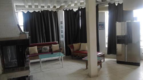 a living room with a couch and a fireplace at le mirador in Hammamet