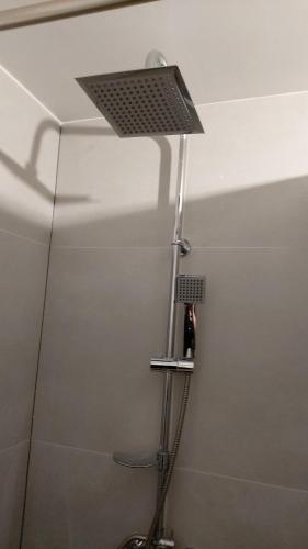 a shower head in a bathroom with a shower at SORKWITY- Pensjonat - STARY GIELĄD in Sorkwity