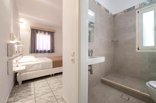 a bathroom with a toilet and a sink and a shower at ASTRA in Parga