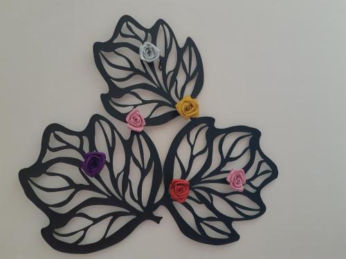 a black and white butterfly brooch with flowers at 7centro in Lastra a Signa
