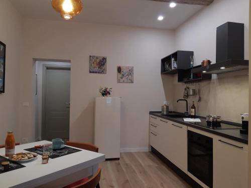 a kitchen with a refrigerator and a counter top at 7centro in Lastra a Signa
