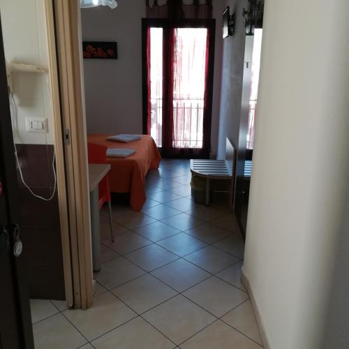 Ένα ή περισσότερα κρεβάτια σε δωμάτιο στο La Locanda Del Mare -Domo- Affittacamere