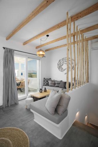 a living room with a couch and a table at Villa Ester Naxos in Kastraki