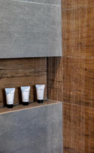 a row of white cups sitting on a shelf at Eclipse Tales in Adamas