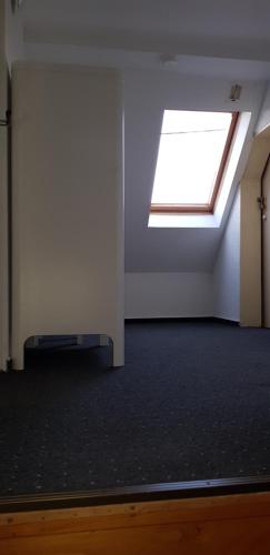 an empty room with a skylight on the ceiling at Ferienhaus Kühnhaide im Erzgebirge in Kühnhaide