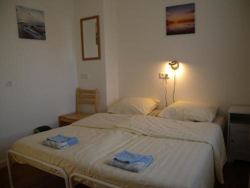 Postel nebo postele na pokoji v ubytování B&B Nobel