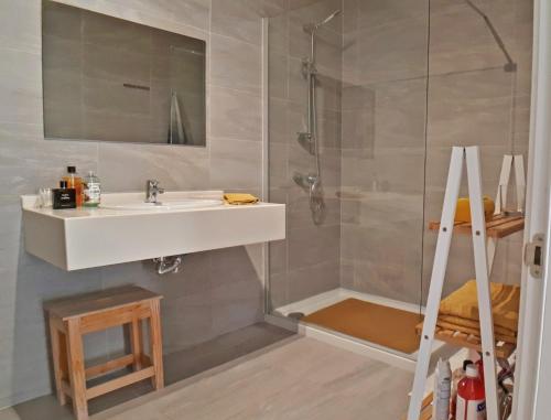 a bathroom with a sink and a shower at Centre Point, Malta's most central in Pieta