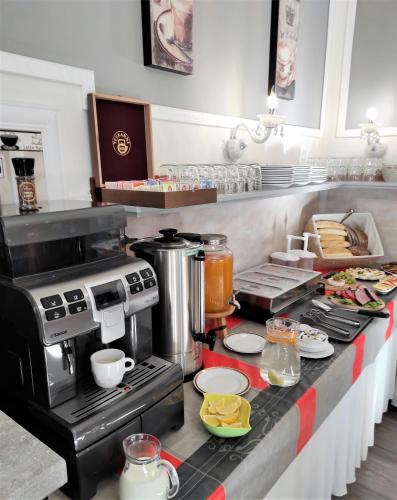 a kitchen with a counter with a coffee maker at Sherwood Hotel Vojkovice nad Ohří in Vojkovice