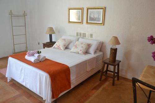 Ένα ή περισσότερα κρεβάτια σε δωμάτιο στο Espaço Mascattes Pousada