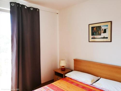 Ένα ή περισσότερα κρεβάτια σε δωμάτιο στο Apartments Zec
