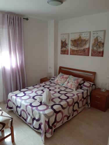 Postel nebo postele na pokoji v ubytování 1ª Linea Playa Deluxe Costa Marina