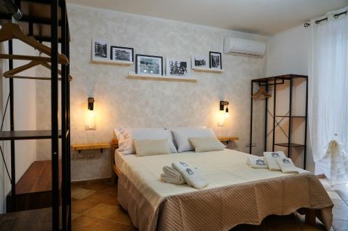 En eller flere senge i et værelse på FamiliaINN Rooms & Apartments