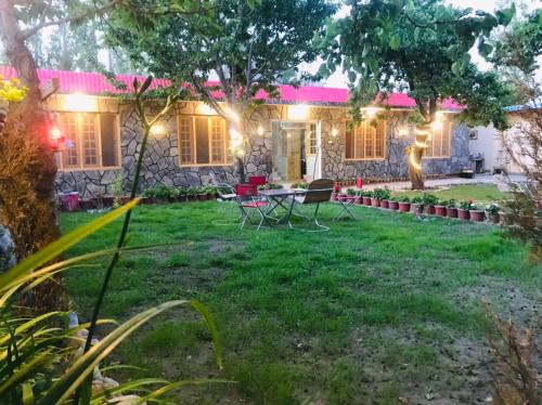 a house with a garden at night at Sehrish Guest House Skardu in Skardu