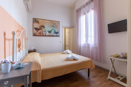 Postel nebo postele na pokoji v ubytování Casa Arsella