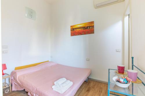 Ένα ή περισσότερα κρεβάτια σε δωμάτιο στο Casa Arsella