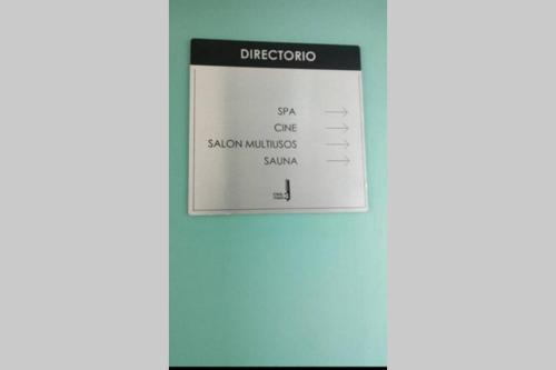 a sign on a wall that reads diverdorocsa sa one slow combustion sauce at Escape Apartments, Balcony, Pool, Gym & Spa in La Julia in Santo Domingo