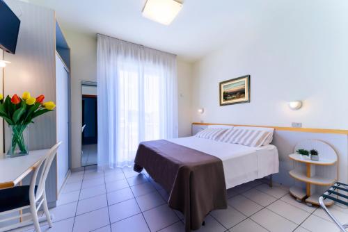 Postel nebo postele na pokoji v ubytování Hotel Astra