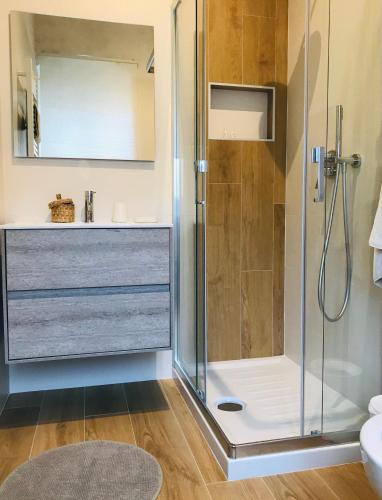 a bathroom with a shower and a sink at Matinee Rooms in Mattinata