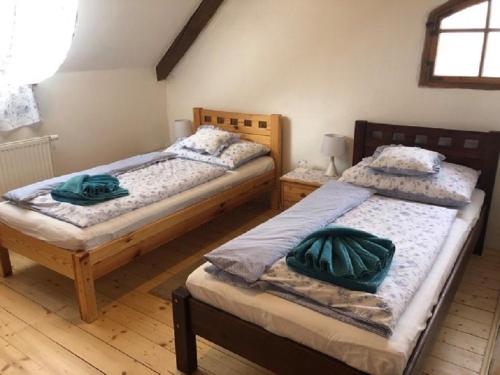 Postel nebo postele na pokoji v ubytování Schwarzenberský panský dvůr
