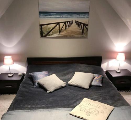 Posteľ alebo postele v izbe v ubytovaní Apartament Łeba