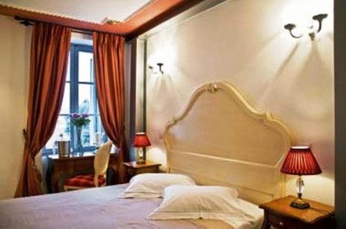 a bedroom with a large bed and a window at Arhontiko Pepos in Nafpaktos